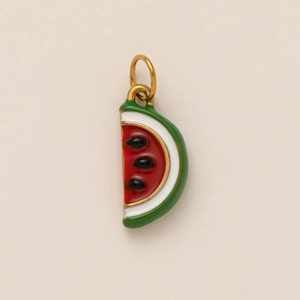 Detailed macro shot of watermelon charm pendant with 18K gold plating and enamel inlay