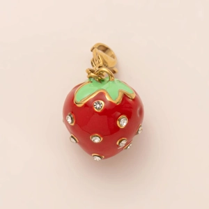 Detail view of 18K gold-plated strawberry pendant with red enamel and sparkling rhinestones