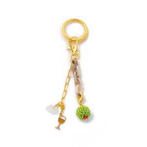 Detail of 18K gold-plated keychain with cloud charm and resin link chain