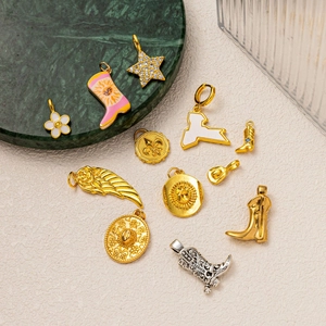 DIY jewelry charms featuring western boots, star and wing pendants in gold and silver