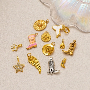 Western cowboy style jewelry charm set featuring gold boots, silver wings, and stars