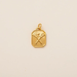 Detailed relief of lacrosse sticks on a 18K gold plated stainless steel pendant