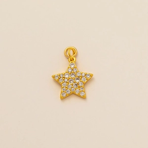Macro shot of gold star pendant with micro-pave white zircon crystals and dual metal loops