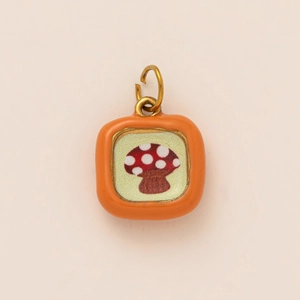 Square orange enamel pendant featuring a red mushroom design in 18K gold plating