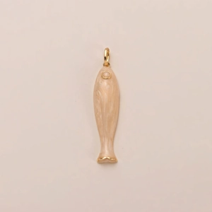 Macro detail of fish-shaped pendant with gold plating and beige marble resin texture