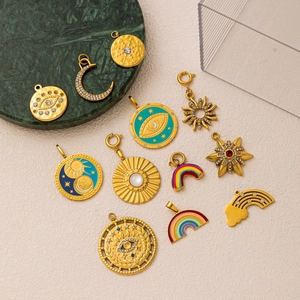 Detailed set of 18K gold plated pendants with colorful enamel sun and evil eye designs