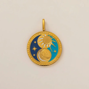 Detailed close-up of 18K gold-plated celestial pendant with sun and moon enamel design