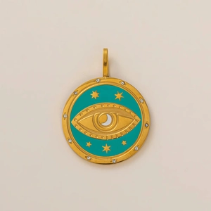 Detail of 18K gold plated evil eye pendant with turquoise enamel and zircon star accents