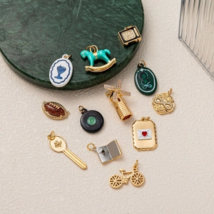 DIY gold plated charm set with enamel horse, bicycle, and heart envelope pendants