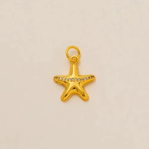 Detailed close-up of a 18K gold-plated starfish pendant with sparkling white zircons