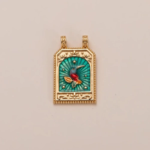 Detail of 18K gold rectangular pendant with enamel bird and beaded border