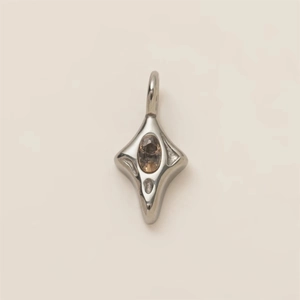 Detailed close-up of a silver fork pendant with a central oval champagne gemstone