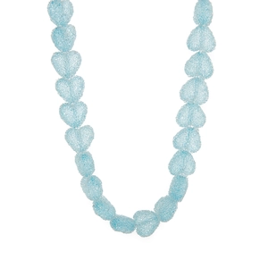 Macro detail of light blue heart-shaped beads with frosted texture and subtle shimmer