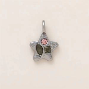 Close-up of star-shaped stainless steel pendant with pink and green gemstones detail