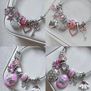 Pink Hello Kitty themed charm bracelet with 18K gold beads and star heart pendants