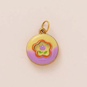 Macro detail of tulip enamel pendant with 18K gold plating and gradient finish