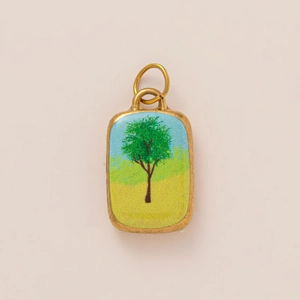 Detailed macro view of 18K gold plated rectangular pendant with green tree landscape