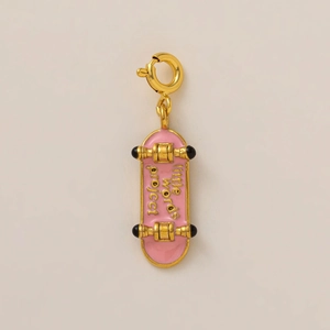 Detail of pink and gold skateboard pendant with spring clasp for DIY jewelry