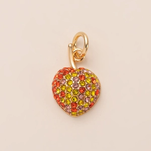 Detailed close-up of heart-shaped gold pendant with multicolored crystal inlay