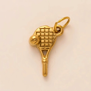 Close-up of golden stainless steel tennis racket and ball pendant with detailed mesh