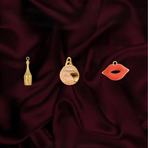 18K gold plated stainless steel pendants featuring champagne, cake and red lips on red silk