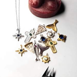 DIY 18K gold plated stainless steel star and cross pendants on a white background