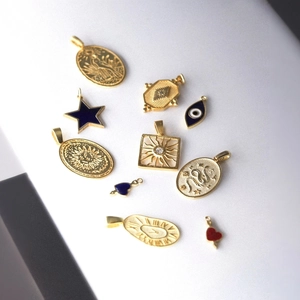 Detailed set of 10 vintage 18K gold-plated star and celestial charms for DIY jewelry