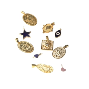 Collection of celestial stainless steel pendants with sun motifs and 18K gold plating finish