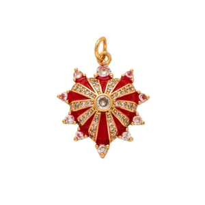 Golden octagonal star pendant with red enamel and pavé crystals on a white background