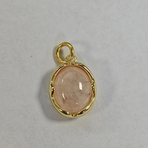 Detailed close-up of oval pink quartz stone pendant with gold plated bezel setting