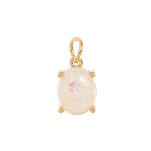 Detail of gold-plated oval opal pendant featuring vibrant multicolored fire and four-prong setting