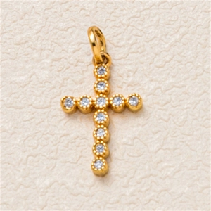 Detail of a gold-plated cross pendant featuring 11 sparkling round zircon stones