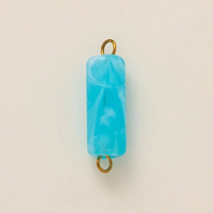 Detail of blue marble resin pendant with double gold plated bail connectors for DIY jewelry