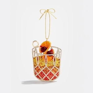 Dettaglio pendente cocktail in oro 18K con strass sfumati e fiocco dorato elegante