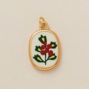 Pendentif ovale vintage avec motif botanique recto-verso et bordure en métal doré