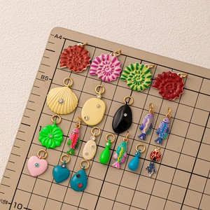 Colorful enamel nautical pendants with heart and shell motifs for DIY jewelry crafts