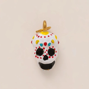 Detailed view of skull charm with 18K gold plating and colorful enamel Day of the Dead design