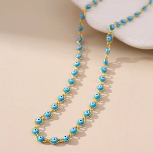 Collana malocchio bohémien con perline in smalto blu e catena dorata in stile turco