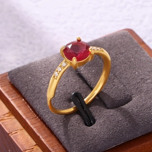 Gold plated emerald cut red zircon open ring with side accents in a luxury display