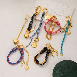 Colorful braided rope keychain set with golden heart charms and various pendants