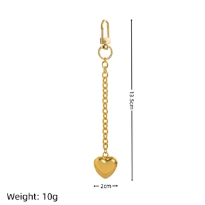 Detailed view of polished gold heart keychain with lobster clasp measuring 13.5cm