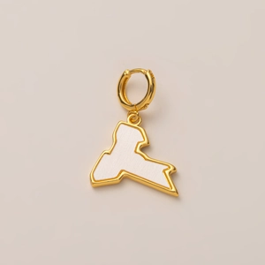 Detail of a 14K gold plated Sicily map charm with white enamel inlay and a ring clasp
