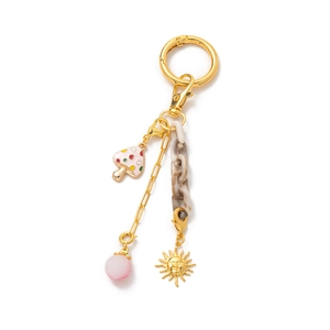 Detail of 18K gold plated keychain with mushroom charm, pearls and sun relief pendant