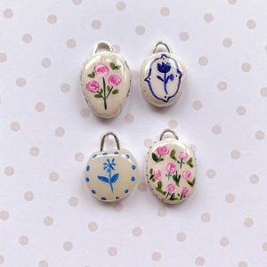Set of four handmade floral ceramic pendants with 18K gold plating and silver rings