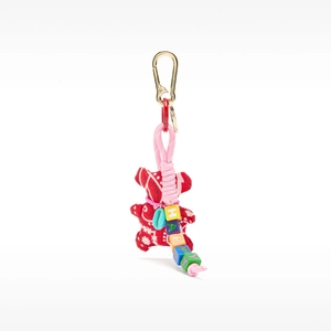 Detail of red bandana bear keychain with pink rope, gold carabiner, and Happy letter beads