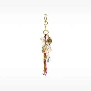 Bohemian bag charm detail with colorful beads, seashell pendants and blue evil eye
