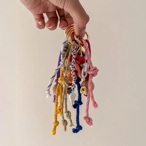 Bohemian colorful woven rope keychain collection with golden rings and charms