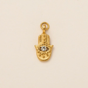Detail of Hamsa hand pendant in 18K gold plating with a sparkling central zircon stone