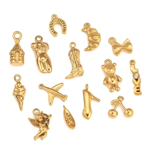 Detail of 18K gold plated stainless steel DIY pendants in various shapes with polished finish