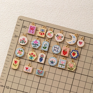 Assorted colorful enamel flower and fruit heart charms with gold-plated copper frames